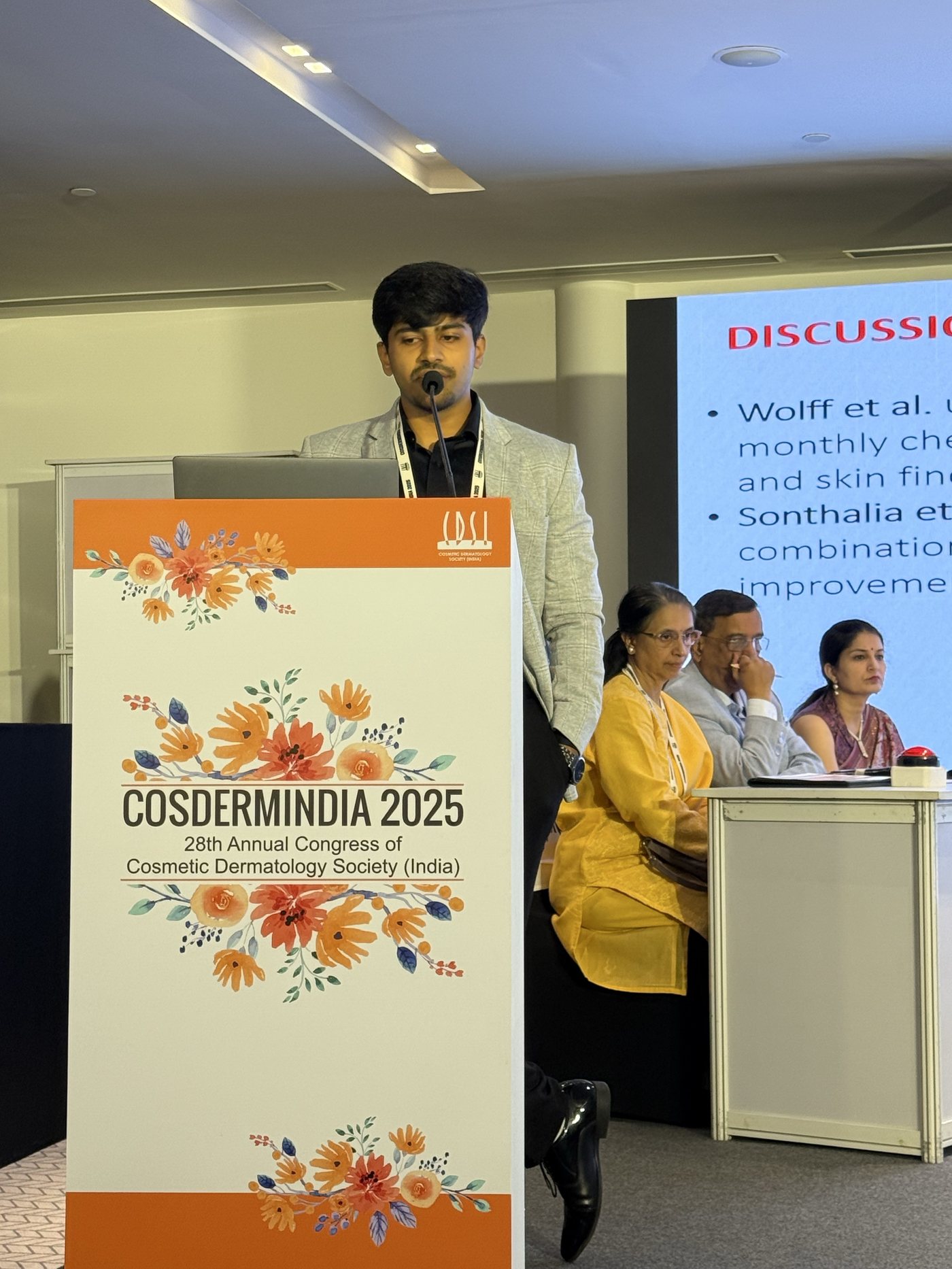 Dr. Ayushman Bindal presenting at COSDERMINDIA 2025, the 28th Annual Congress of the Cosmetic Dermatology Society of India